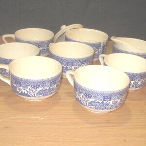 9 Vintage Blue Willow Dishes 6  Cups & 1 Creamer and 1 Sugal Bowl with lid..